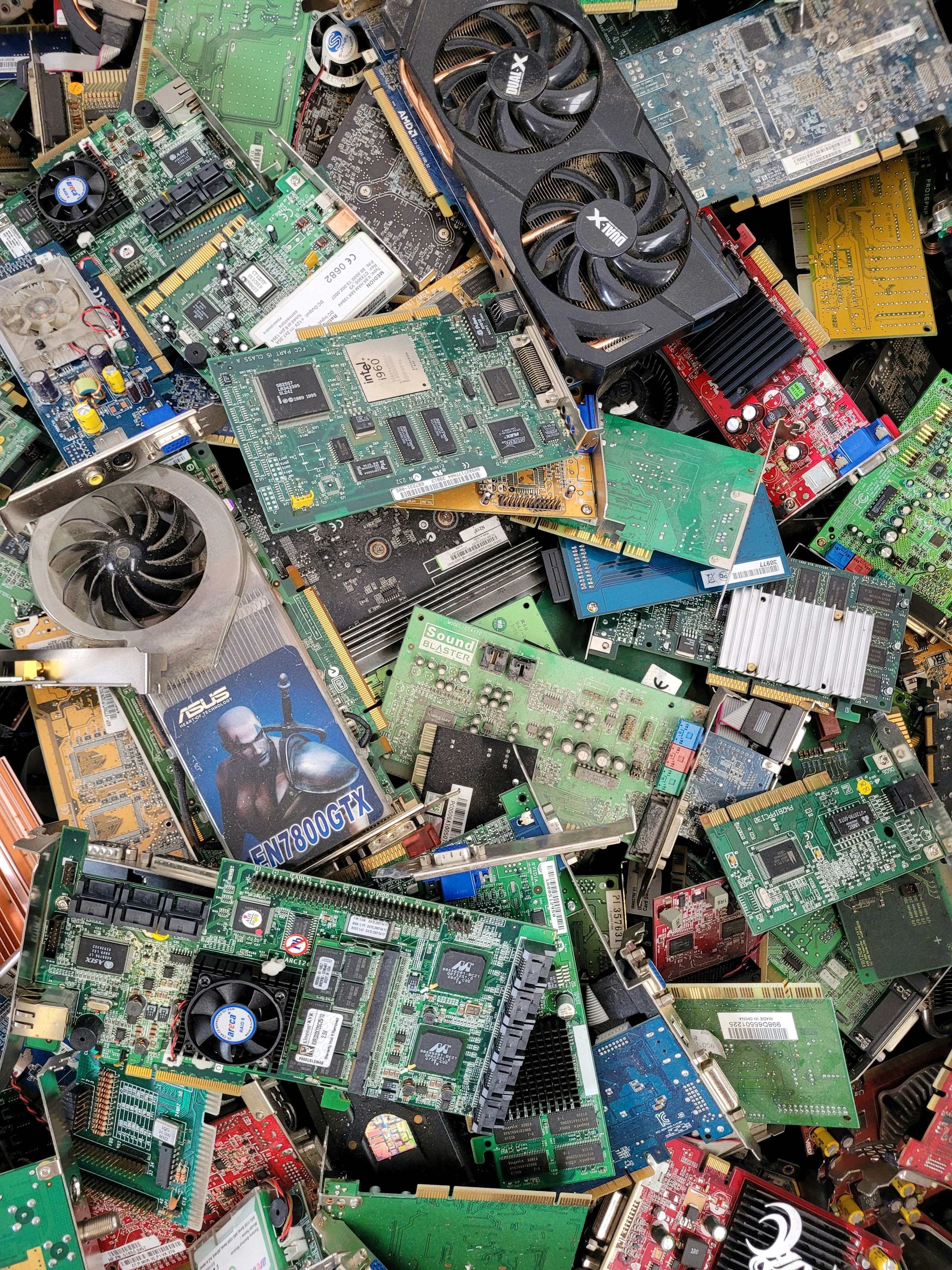 A box of old electronics and cables ready for recycling
